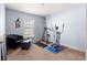 A flex room is staged as a workout room, featuring carpet and a window for natural light at 4881 Se 91St Pl, Ocala, FL 34480