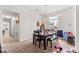 Dining area featuring seating for six, large windows, and neutral decor at 4881 Se 91St Pl, Ocala, FL 34480