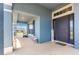 Charming front porch of home featuring blue siding and door, and featuring a welcome sign at 4881 Se 91St Pl, Ocala, FL 34480
