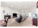 Spacious living room with large sofa, entertainment center, and an adjacent dining area at 4881 Se 91St Pl, Ocala, FL 34480