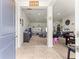 Open-concept living area with neutral colors, tile entryway, and plenty of natural light at 4881 Se 91St Pl, Ocala, FL 34480