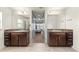 En suite bathroom features granite counters, dual sinks, tile floor and views into the Primary bedroom at 4881 Se 91St Pl, Ocala, FL 34480