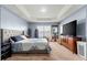 Spacious main bedroom offers carpet, tray ceiling, and neutral tones for a relaxing atmosphere at 4881 Se 91St Pl, Ocala, FL 34480
