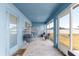 Screened in patio is decorated with two chairs and a modern egg chair with a privacy view fence at 4881 Se 91St Pl, Ocala, FL 34480