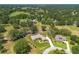 Aerial view of expansive property featuring home outlined in white, and mature landscaping at 5090 Nw 80Th Avenue Rd, Ocala, FL 34482