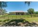 Lovely backyard with a screened lanai and full fencing for privacy, creating a serene outdoor space at 5090 Nw 80Th Avenue Rd, Ocala, FL 34482