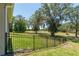 Spacious fenced backyard with mature trees offering shade and privacy to the property at 5090 Nw 80Th Avenue Rd, Ocala, FL 34482
