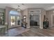 Inviting entryway showcasing high ceilings, decorative double doors, and seamless access to a home office at 5090 Nw 80Th Avenue Rd, Ocala, FL 34482