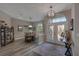 Entryway featuring high ceilings, stained glass double doors, and a dining room with hardwood floors at 5090 Nw 80Th Avenue Rd, Ocala, FL 34482