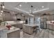 Gourmet kitchen features stainless steel appliances, granite counters, and a large island with seating at 5090 Nw 80Th Avenue Rd, Ocala, FL 34482