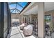 Screened lanai with a glass roof, offering an airy and bright outdoor living space for relaxation and enjoyment at 5090 Nw 80Th Avenue Rd, Ocala, FL 34482