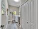 Functional laundry room with washer/dryer, storage cabinets, and charming decor details at 5090 Nw 80Th Avenue Rd, Ocala, FL 34482