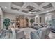 A comfortable living room with a decorative ceiling, stylish furniture, and ample natural light at 5090 Nw 80Th Avenue Rd, Ocala, FL 34482