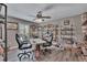 Bright office with unique decor, featuring hardwood floors and a ceiling fan for added comfort at 5090 Nw 80Th Avenue Rd, Ocala, FL 34482