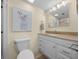 Clean bathroom features granite vanity, white cabinets, and modern vanity lighting at 515 Midway Dr # A, Ocala, FL 34472