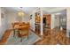 Cozy dining room with wood floors, a chandelier, and a wooden dining table with seating for six at 515 Midway Dr # A, Ocala, FL 34472