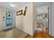 Home entrance featuring a decorative glass door and a hallway view into the bedroom at 515 Midway Dr # A, Ocala, FL 34472