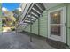 Condominium entrance with a metal staircase and decorative glass door at 515 Midway Dr # A, Ocala, FL 34472