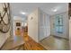 Inviting entryway with hardwood floors and a view into the living and dining areas at 515 Midway Dr # A, Ocala, FL 34472