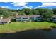 A lakefront condo offers stunning water views, a manicured lawn, and a patio perfect for outdoor enjoyment at 515 Midway Dr # A, Ocala, FL 34472