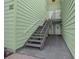 Building exterior featuring stairs that lead to a second-story entrance at 515 Midway Dr # A, Ocala, FL 34472