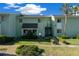 Well-maintained two-story condo with manicured landscaping, sidewalk, and inviting curb appeal at 515 Midway Dr # A, Ocala, FL 34472
