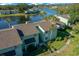 Inviting two-story condo with lush landscaping and serene lake view, creating a peaceful residential setting at 515 Midway Dr # A, Ocala, FL 34472