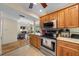 Open kitchen layout with granite counters and stainless steel appliances flowing into the living area at 515 Midway Dr # A, Ocala, FL 34472