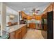 Traditional-style kitchen featuring granite countertops, stainless steel appliances, and ample cabinet space at 515 Midway Dr # A, Ocala, FL 34472