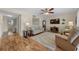 Cozy living area featuring wood flooring, a comfortable sofa, and view of hall to bedrooms at 515 Midway Dr # A, Ocala, FL 34472