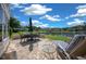 Relaxing patio featuring outdoor dining set, comfortable lounge chair, and serene water views in a picturesque setting at 515 Midway Dr # A, Ocala, FL 34472