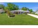 Charming single-story home with a well-manicured lawn and mature landscaping at 8237 108Th Street Sw Rd, Ocala, FL 34481