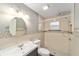 Bathroom featuring decorative tiling, a shower, and ample lighting at 8831 Sw 94Th Ln # H, Ocala, FL 34481
