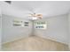 Spacious bedroom with neutral tones, ceiling fan, and ample natural light at 8831 Sw 94Th Ln # H, Ocala, FL 34481