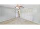 Bedroom featuring ample closet space and neutral color scheme at 8831 Sw 94Th Ln # H, Ocala, FL 34481