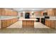 Eat-in kitchen with black appliances, recessed lighting, and light wood cabinets is a great gathering place at 8831 Sw 94Th Ln # H, Ocala, FL 34481