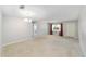 Large living room offering neutral paint, carpet, and bright natural light at 8831 Sw 94Th Ln # H, Ocala, FL 34481
