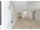 Spacious living room with neutral paint, carpet, and ample natural light at 8831 Sw 94Th Ln # H, Ocala, FL 34481