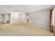 Large living room offering neutral paint, carpet, and bright natural light at 8831 Sw 94Th Ln # H, Ocala, FL 34481