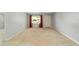 Large living room offering neutral paint, carpet, and bright natural light at 8831 Sw 94Th Ln # H, Ocala, FL 34481