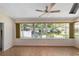 Bright sunroom with large windows offering views of the backyard at 8831 Sw 94Th Ln # H, Ocala, FL 34481