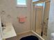 Bathroom with a glass door shower, a sink, and floral wallpaper at 9288 Sw 93Rd Cir, Ocala, FL 34481
