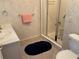 Bathroom featuring a glass door shower, a sink, and floral wallpaper at 9288 Sw 93Rd Cir, Ocala, FL 34481