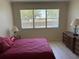 Inviting bedroom features warm lighting and a relaxing atmosphere at 9288 Sw 93Rd Cir, Ocala, FL 34481
