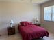 Well-lit bedroom featuring wood-look flooring and stylish furnishings at 9288 Sw 93Rd Cir, Ocala, FL 34481