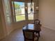 Bright dining area with a charming chandelier and natural light at 9288 Sw 93Rd Cir, Ocala, FL 34481