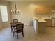 Charming dining area featuring light cabinetry and a chandelier at 9288 Sw 93Rd Cir, Ocala, FL 34481