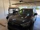 Garage featuring a car and a golf cart, showcasing the spaciousness and convenience at 9288 Sw 93Rd Cir, Ocala, FL 34481