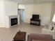 Living room features tile flooring, a fireplace, and comfortable furniture at 9288 Sw 93Rd Cir, Ocala, FL 34481