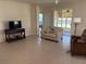 Bright and airy living room featuring tiled floors, sliding-glass doors, and comfortable seating at 9288 Sw 93Rd Cir, Ocala, FL 34481